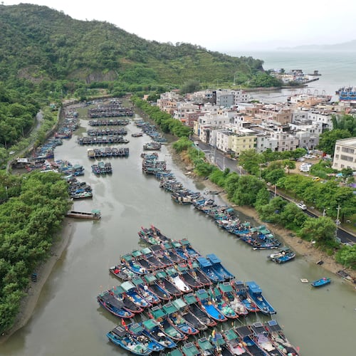 In this photo released by Xinhua News Agency, a drone photo shows fishing boats taking shelter ahead of Typhoon Noul at a port in Shenzhen-Shanwei Special Cooperation Zone in southern China's Guangdong Province on Saturday, July 25, 2026. (Lu Hanxin/Xinhua via AP)