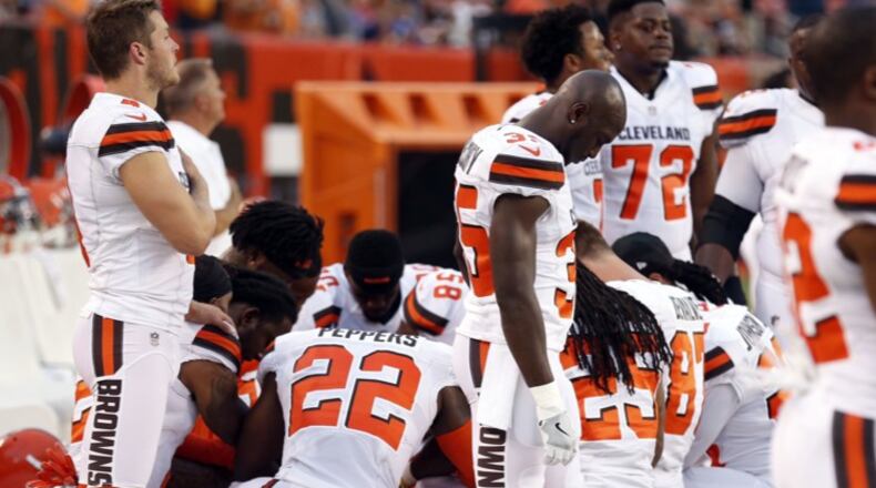 Members of the Cleveland Browns knelt in prayer during the national anthem before their game against the New York Giants on Aug. 21.