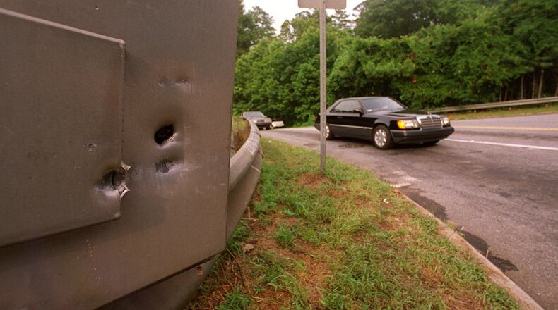970723 - Cobb County, Georgia - Bullet holes pepper the traffic control box at Johsnon Ferry Road at Riverside Drive on Wednesday 7/23/97 after someone had shot it. This view shows traffic heading southbound on Riverside Drive getting ready to cross onto Johnson Ferry Road. (AJC Staff Photo/Frank Niemeir)