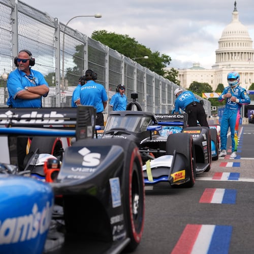 Race car diver Scott McLaughlin gets out of his car after a qualifying race prior to Sunday's Freedom 250 Grand Prix auto race in Washington, Saturday, Aug. 22, 2026.(AP Photo/Alex Brandon)