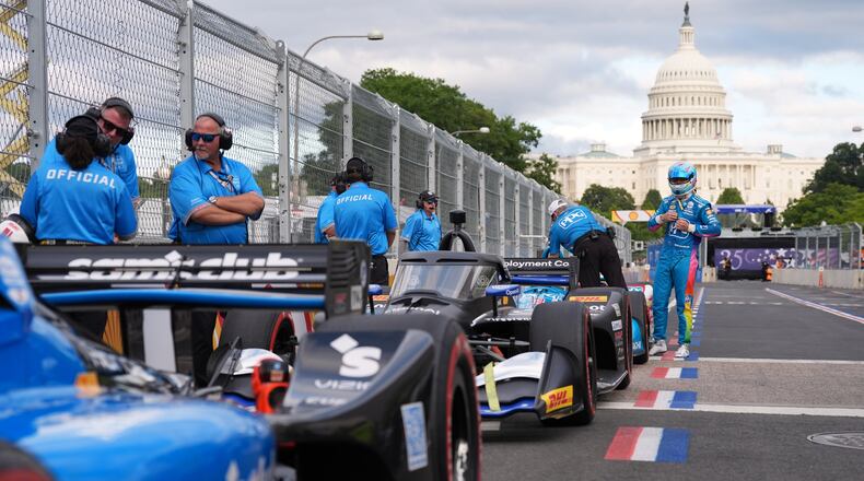Race car diver Scott McLaughlin gets out of his car after a qualifying race prior to Sunday's Freedom 250 Grand Prix auto race in Washington, Saturday, Aug. 22, 2026.(AP Photo/Alex Brandon)