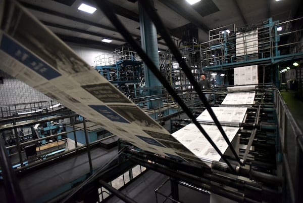 The Atlanta Journal-Constitution's MLK special section is printed out at the newspaper's printing plant in Norcross. Hyosub Shin/AJC 2018)