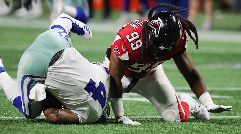 Falcons defensive end Adrian Clayborn records the fifth sack of Cowboys quarterback Dak Prescott during the second half in a NFL football game on Sunday, Nov. 12, 2017, in Atlanta.