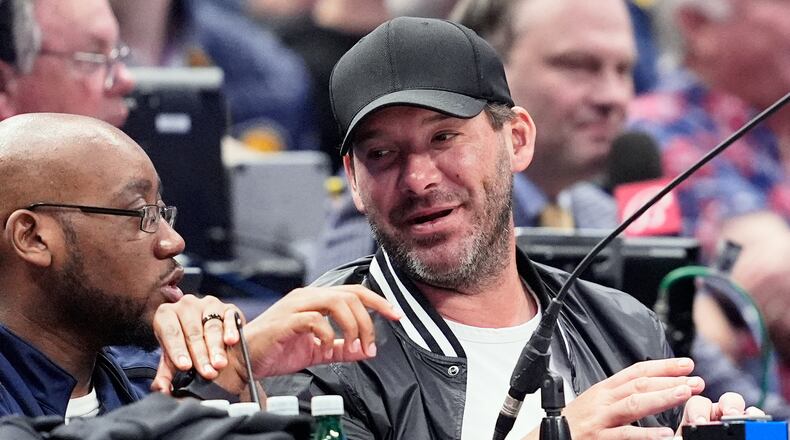 FILE - Former NFL quarterback Tony Romo, right, attends an NBA basketball game between the Indiana Pacers and the Dallas Mavericks on March 5, 2024, in Dallas. (AP Photo/Tony Gutierrez, File)