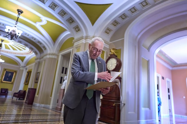 Senate Minority Leader Chuck Schumer, D-N.Y., looks over his notes as he meets with reporters at the Capitol in Washington, Tuesday, June 10, 2025. (AP Photo/J. Scott Applewhite)