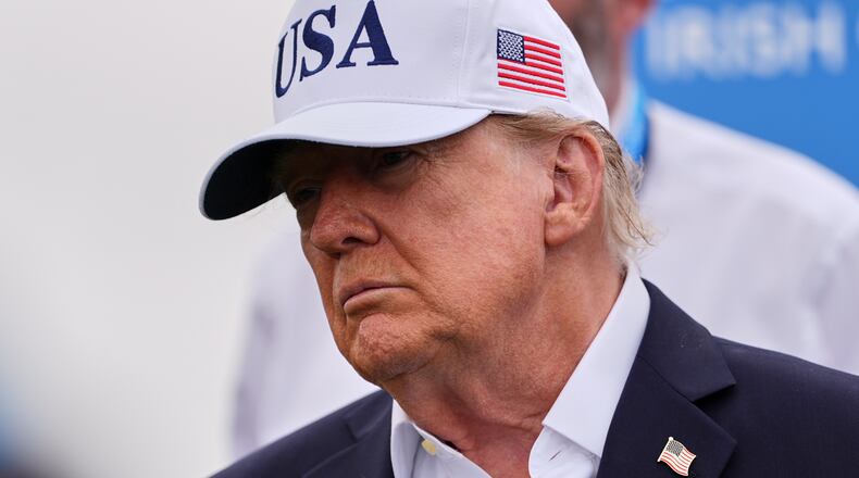 U.S. President Donald Trump attends the Irish Open golf tournament at Trump International Golf Links in Doonbeg, Ireland, Sunday, Sept. 13, 2026. (AP Photo/Julia Demaree Nikhinson)