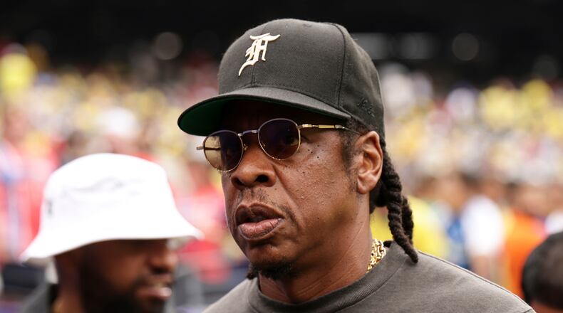 Jay-Z looks on ahead of the start the World Cup round of 16 soccer match between Brazil and Norway in East Rutherford, N.J., near New York, Sunday, July 5, 2026. (AP Photo/Adam Hunger)