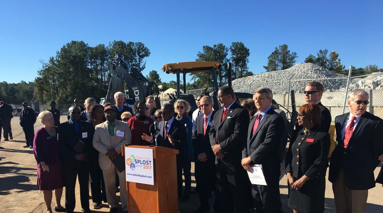 DeKalb County CEO Mike Thurmond, surrounded by mayors and government officials, speaks about the SPLOST ballot measure ahead of the vote in November 2017. MARK NIESSE / MARK.NIESSE@AJC.COM