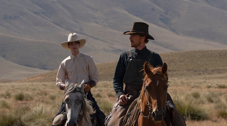 THE POWER OF THE DOG (L to R): KODI SMIT-McPHEE as PETER, BENEDICT CUMBERBATCH as PHIL BURBANK in THE POWER OF THE DOG. Cr. KIRSTY GRIFFIN/NETFLIX © 2021