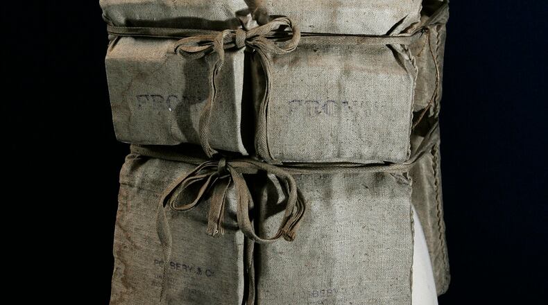 FILE - A Titanic life-preserver, belong to a survivor is shown, London, Wednesday, May 16, 2007. ((AP Photo/Sang Tan)