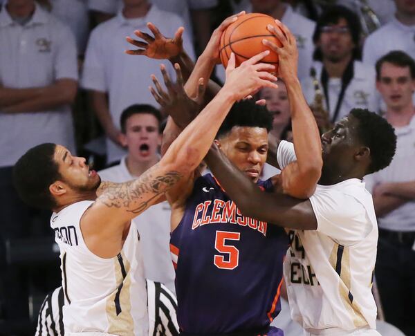 January 12, 2017, Atlanta: Georgia Tech defenders Josh Heath (left) and Abdoulaye Gueye force a turnover on a double team against Clemson forward Jaron Blossomgame during an NCAA basketball game on Thursday, Jan. 12, 2017, in Atlanta. Curtis Compton/ccompton@ajc.com