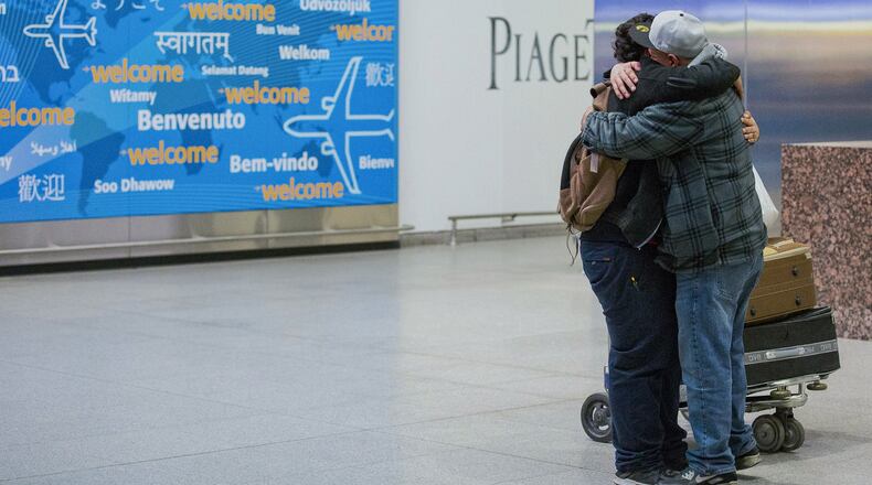 In this Feb. 5 photo Abdullah Alghazali, right, hugs his 13-year-old son, Ali Abdullah Alghazali, after the Yemeni boy stepped out of an arrival entrance at John F. Kennedy International Airport in New York. U.S. Customs and Border Protection officers will be key players in implementing President Donald Trump’s revised travel ban, affecting visitors from six mostly Muslim countries: Iran, Libya, Somalia, Sudan, Syria, and Yemen. (AP Photo/Alexander F. Yuan, File)
