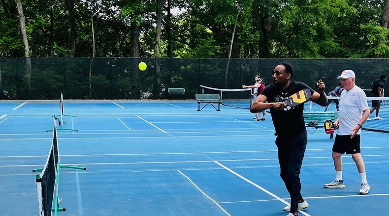 Mayor Andre Dickens plays pickleball