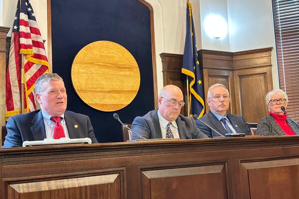 Alaska House Majority Leader Chuck Kopp, at left, speaks to reporters about the state budget on Tuesday, April 8, 2025, in Juneau, Alaska, and is shown with Rep. Andy Josephson, House Speaker Bryce Edgmon and Rep. Louise Stutes. (AP Photo/Becky Bohrer)
