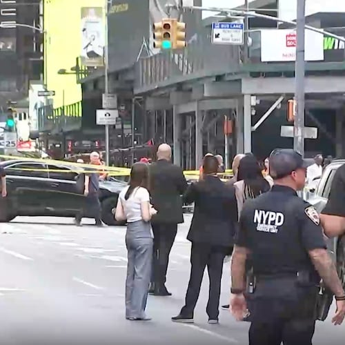 This image made from video provided by WABC shows NYPD officers on the scene after a woman brandishing two large knives was shot by officers in Times Square in New York, Monday, Aug. 31, 2026. (WABC via AP)