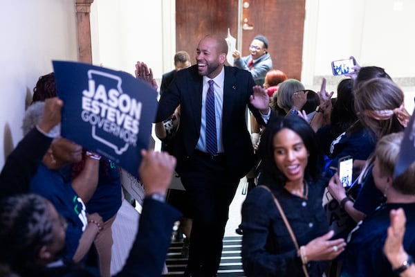 Democratic candidate for governor Jason Esteves is greeted by supporters as he enters to file paperwork to run for election at the Capitol in Atlanta on Monday, March 2, 2026. (Arvin Temkar/AJC)