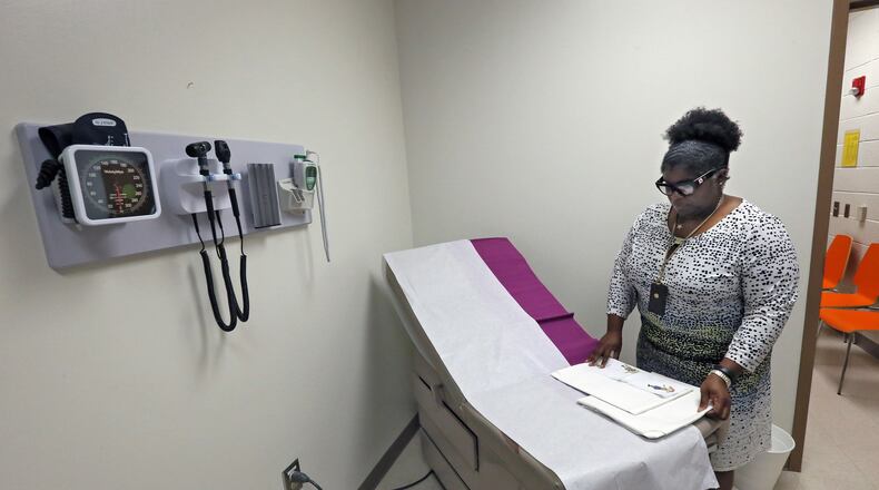 Last school year, Principal Charnita V. West checked out a soon to be opened exam room at Dobbs Elementary School in Atlanta. Now, Georgia is making a play that would double the number of school nurses using Medicaid. BOB ANDRES /BANDRES@AJC.COM