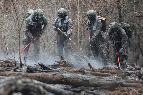 South Korean soldiers work to prevent the further spread of wildfires in Uiseong, South Korea, Thursday, March 27, 2025. (Yoon Kwan-shik/Yonhap via AP)