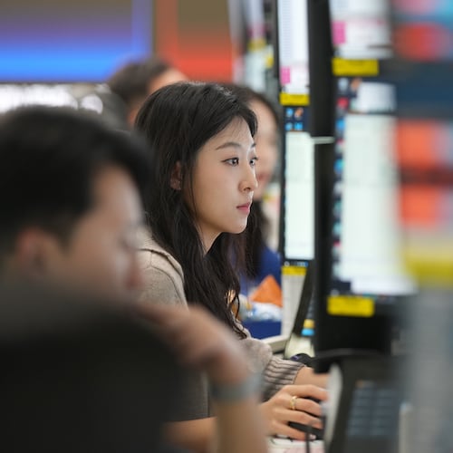 A dealer watches computer monitors at a dealing room of Hana Bank in Seoul, South Korea, Friday, May 8, 2026. (AP Photo/Lee Jin-man)