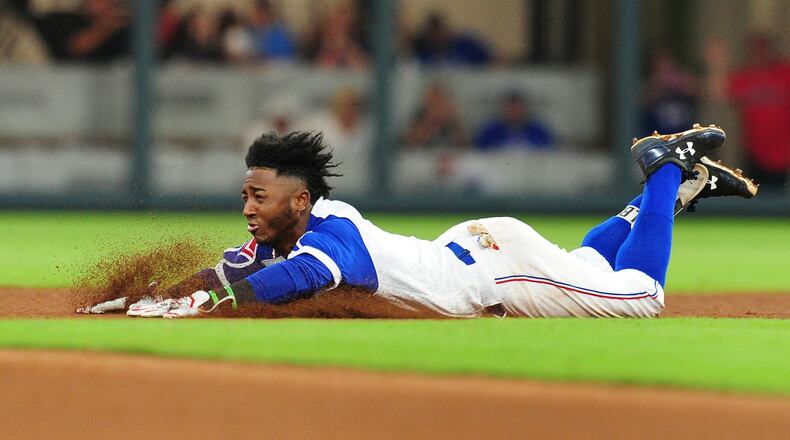 Ozzie Albies slides into second base with a double. The Braves are working with the prized second-base prospect on  changes to his swing to fully utilize his speed. (Photo by Scott Cunningham/Getty Images)