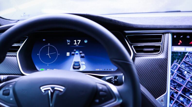 A lot of Lyft and Uber drivers are indoors these days, idled by lack of business and the fear of spreading the coronavirus. A new law makes them eligible for jobless benefits, but so far, they aren’t getting any checks in Georgia. (Bloomberg photo by Christopher Goodney)