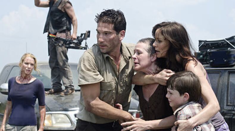 Actors Laurie Holden, Norman Reedus, Jon Bernthal, Melissa Suzanne McBride, Sarah Wayne Callies and Chandler Riggs (left to right) appear in the second season premiere of "The Walking Dead," which is set (and filmed) in Georgia. AMC