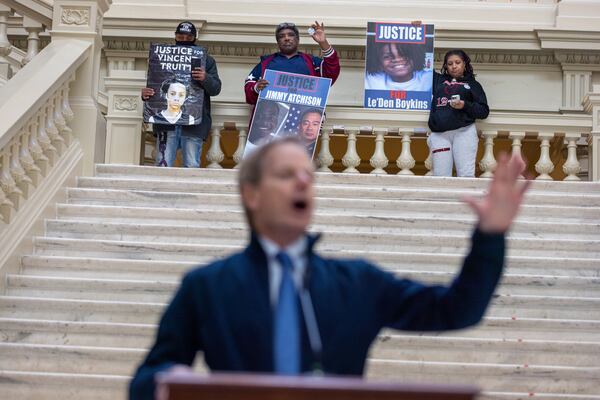 Andrae Truitt, Jimmy Hill (Jimmy Atchison’s father) and Toni Franklin-Boykins demonstrate on behalf of their deceased children during a rally at the state Capitol in 2023. (Arvin Temkar / arvin.temkar@ajc.com)