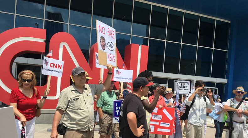 People demonstrated against CNN news coverage Saturday in Atlanta. RHONDA COOK / RHONDA.COOK@AJC.COM