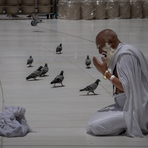 A Muslim pilgrim prays in front of the Kaaba, Islam's holiest site in the holy city of Mecca during the annual hajj pilgrimage, Saudi Arabia, Sunday, May 24, 2026. (AP Photo/Altaf Qadri)