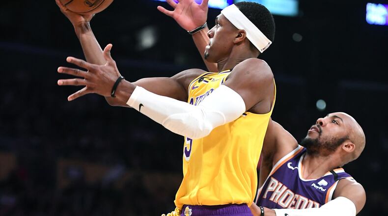 The Los Angeles Lakers' Rajon Rondo beats Phoenix Suns' Jevon Carter to score a basket on February 10, 2020, at the Staples Center in Los Angeles. (Wally Skalij/Los Angeles Times/TNS)