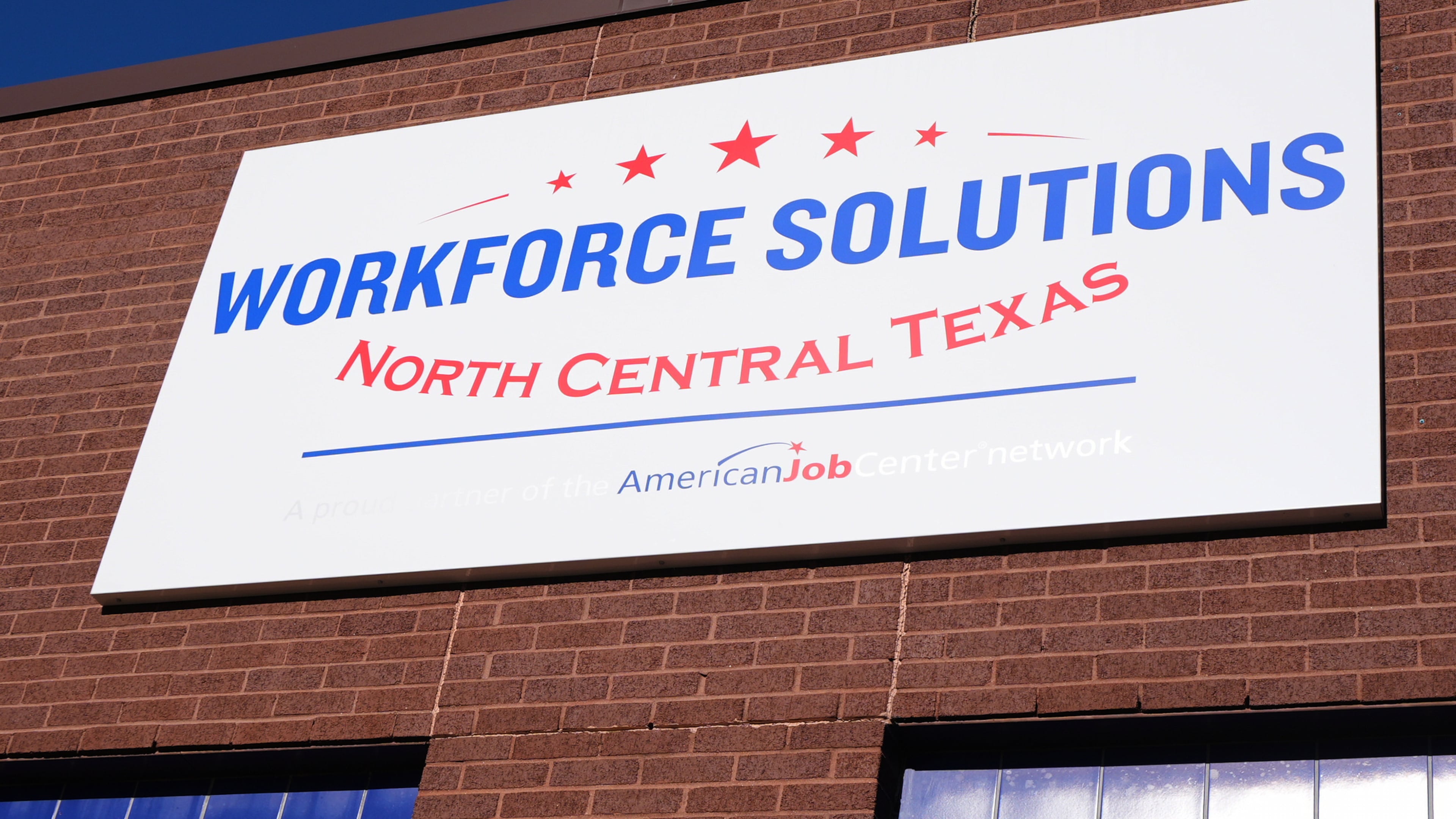 The sign on the exterior of the Workforce Solutions of North Central Texas is shown outside the office Thursday, Oct. 30, 2025, in Plano, Texas. (AP Photo/Tony Gutierrez)