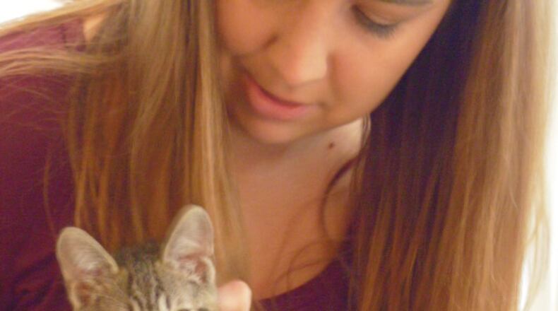 Special needs kitten Finnegan Grant, happily adopted by Roswell music therapist, Emma Wheat. Vicki Griffin for the AJC