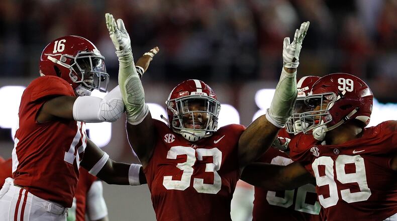 Another game, another Alabama celebration: This one featuring Anfernee Jennings (33) after his interception against Auburn. (Kevin C. Cox/Getty Images)