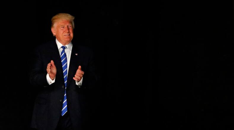 Republican presidential candidate Donald Trump arrives on stage at Gilley's in Dallas. Trump was in Texas on Thursday with plans to hold rallies and fundraisers. Ron Jenkins/Getty Images