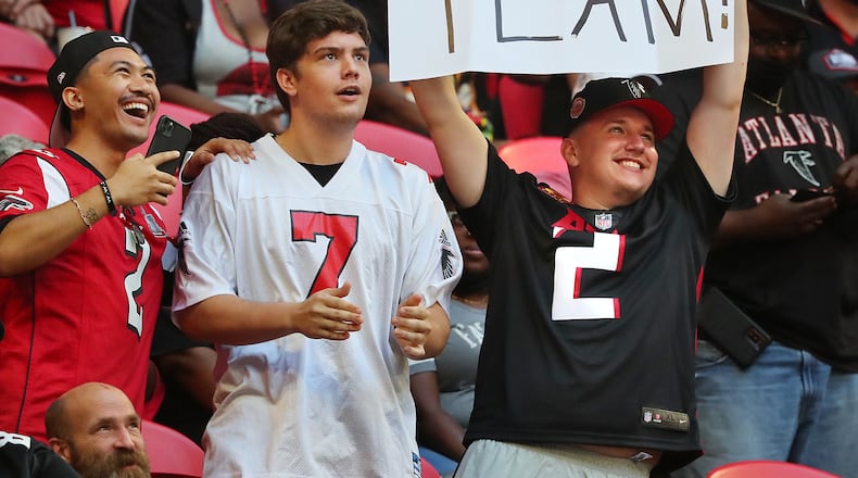 Young Falcons fans cheer their team during the first quarter against the Tennessee Titans in an NFL preseason football game on Friday, August 13, 2021, in Atlanta. “Curtis Compton / Curtis.Compton@ajc.com”