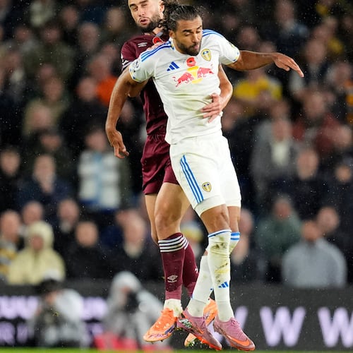 West Ham United's Max Kilman, rear, and Leeds United's Dominic Calvert-Lewin in action during the English Premier League soccer match between Leeds United and West Ham United at Elland Road, Leeds, England, Friday Oct. 24, 2025. (Danny Lawson/PA via AP)