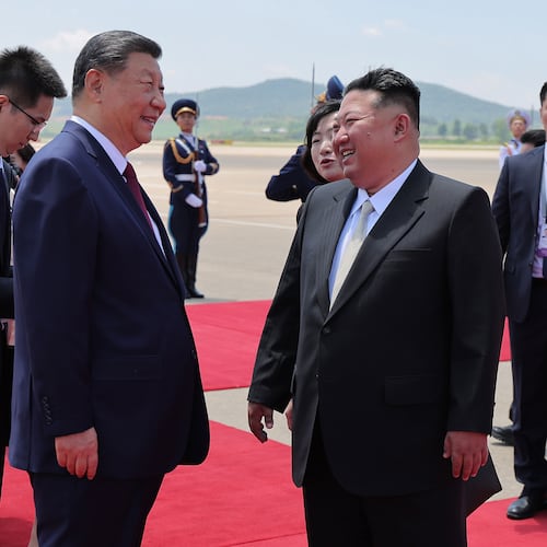 In this photo provided by the North Korean government, North Korean leader Kim Jong Un, front right, greets Chinese President Xi Jinping, center left, on the latter's arrival at the airport in Pyongyang, Monday, June 8, 2026. Independent journalists were not given access to cover the event depicted in this image distributed by the North Korean government. The content of this image is as provided and cannot be independently verified. Korean language watermark on image as provided by source reads: "KCNA" which is the abbreviation for Korean Central News Agency. (Korean Central News Agency/Korea News Service via AP)