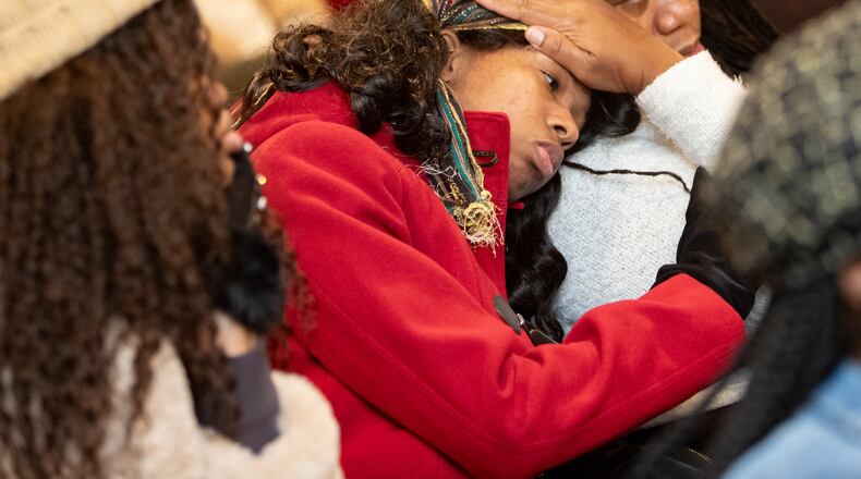 Rockdale County community members gathered at a community forum on Tuesday, Dec. 3, 2024, at The Movement Church in support of revoking BioLab's business license after the chemical fire in September. Imani Handfield, left, is with her mother Juvier Houston-Handfield, after hearing that long-term health risks are likely higher for women and could concern reproduction. (Jenni Girtman for The Atlanta Journal-Constitution)