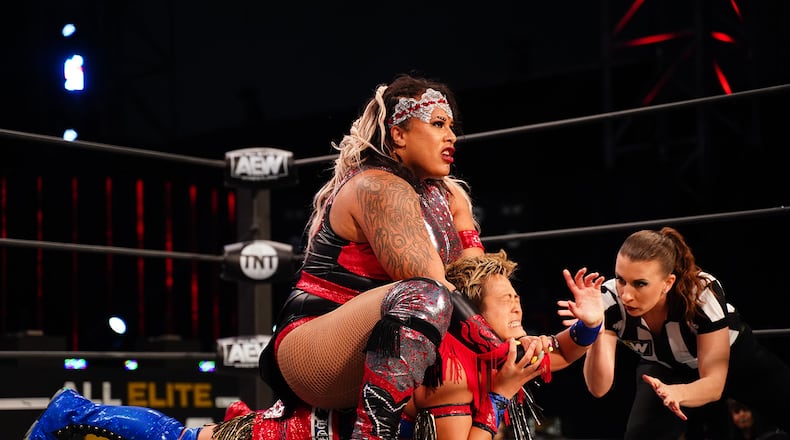 Nyla Rose delivers a devastating Camel Clutch (a rear chinlock while seated on an opponent's back) to Ryo Mizunami on an All Elite Wrestling program. Rose was AEW's second woman's champ and is the first openly transgender wrestler. (Courtesy of TNT)