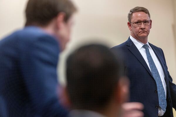 Gary Coffin, co-council for the Hackman estate, looks to Santa Fe County attorney, Walker Boyd, left, and and Peter Valencia, center, during witness testimony in the Hackman estate privacy case before Judge Matthew J. Wilson in District Court in Santa Fe, N.M., Monday, March 31, 2025. (Michael G. Seamans/Santa Fe New Mexican via AP, Pool)
