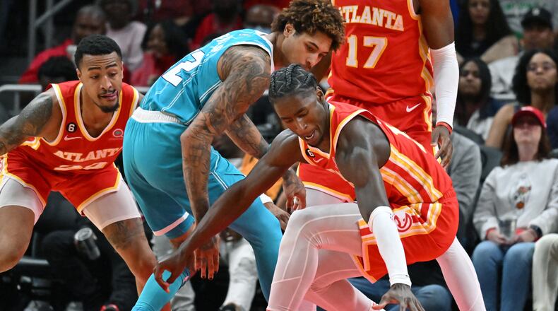Hawks forward AJ Griffin (right) has been taking advantage of his opportunities at the start of his rookie season. (Hyosub Shin / Hyosub.Shin@ajc.com)