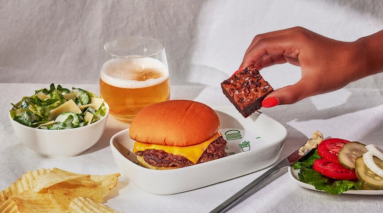 Delta Air Lines will serve Shake Shack cheeseburgers to first class customers on some flights out of Boston. Source: Delta