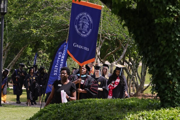 Clayton State University graduates walk into the Athletic Center for spring 2024 graduation ceremony on Friday, May 3, 2024. (Natrice Miller/ AJC)