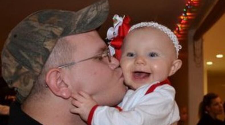 Trooper Adam Aaron and his daughter in 2011