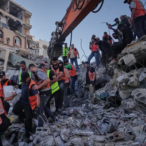 Palestinian civil defense crews carry a body from the rubble of a collapsed building that housed displaced Palestinians and was heavily damaged during the Israel-Hamas war, in Gaza City, Wednesday, Sept. 16, 2026. (AP Photo/Jehad Alshrafi)