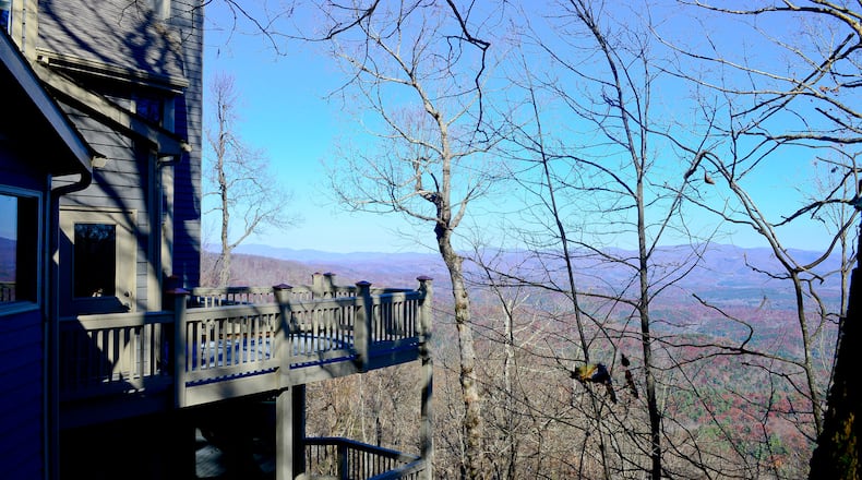 Two levels of decks nearly surround John and Andrea Pruitt's three-bedroom, three-bath home in Big Canoe. They increased the size of the decks in a renovation after buying the home in 2003.