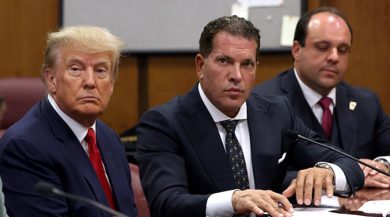 Donald Trump, left, will face charges of falsifying business records Monday in a New York City courtroom. It will be the first-ever criminal trial of a former president. (Andrew Kelly/Pool/Getty Images/TNS)