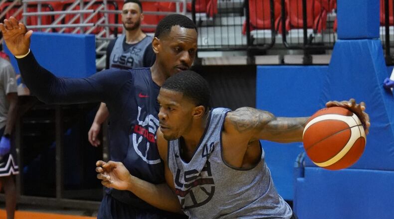 Former Hawks player Joe Johnson works against James Nunnally during a Team USA practice.