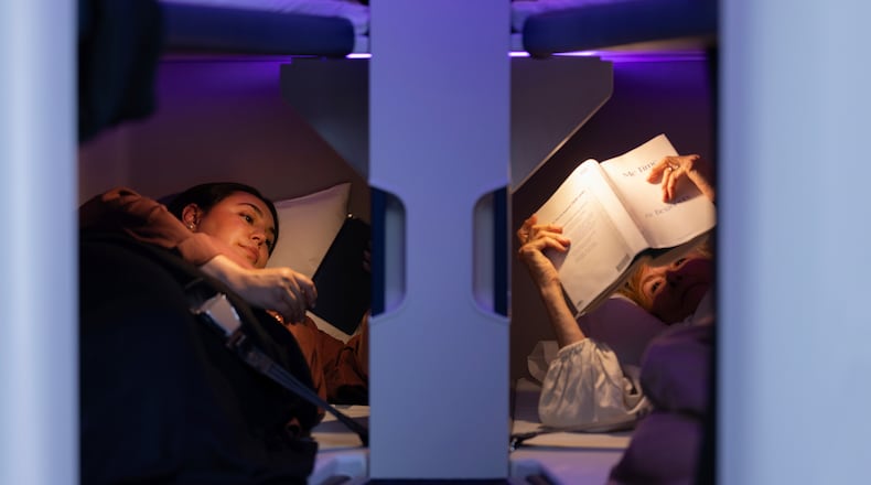 This photo provided by Air New Zealand shows sleeping pods in a mock-up of a plane cabin in Auckland, New Zealand. (Air New Zealand via AP)