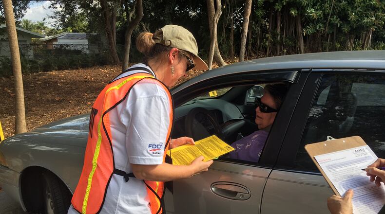 CarFit volunteer Lucy Mead of North Palm Beach, Florida, speaks with Shirley Hennessey  during a session to make recommendations on how Hennessey can make her car more safe and comfortable at the Mae Volen Senior Center in Boca on Dec. 6, 2016.